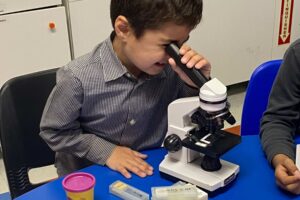 Student using a microscope